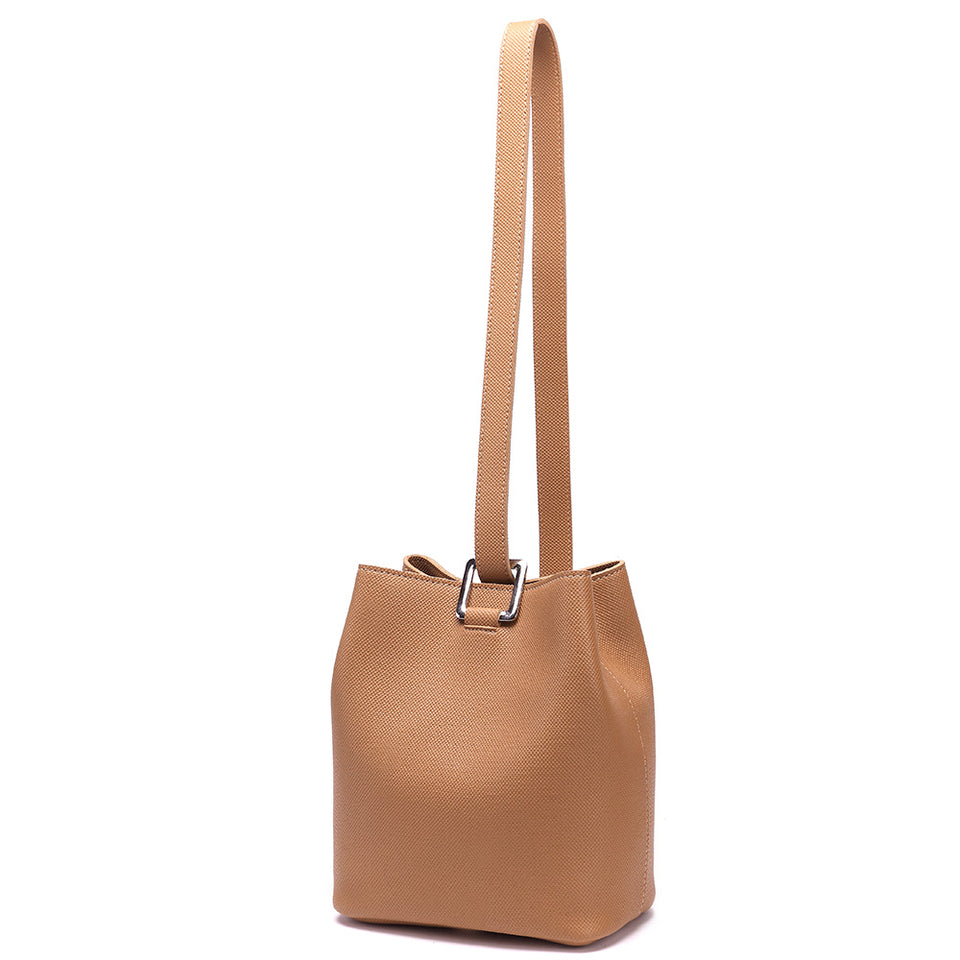 Cutout metal hardware faux leather bucket bag in Beige