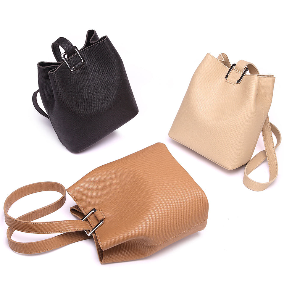 Cutout metal hardware faux leather bucket bag in Beige