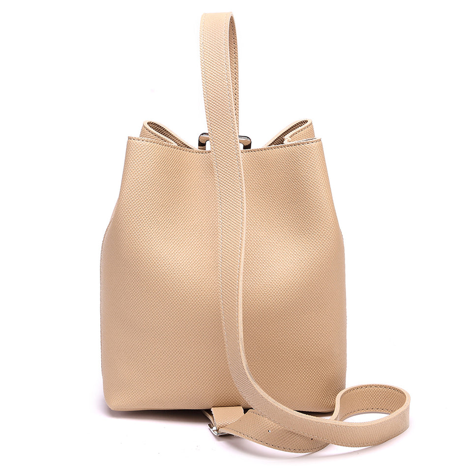 Cutout metal hardware faux leather bucket bag in Beige