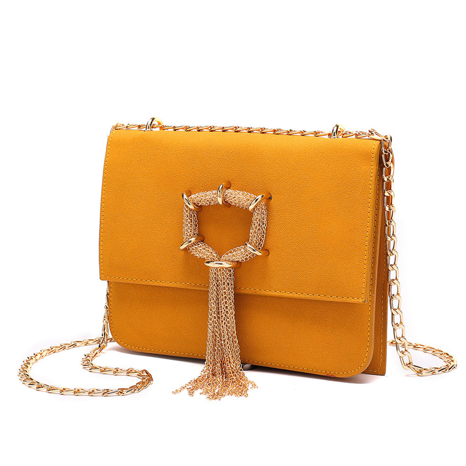 Cable chain fringed faux suede crossbody bag in Yellow